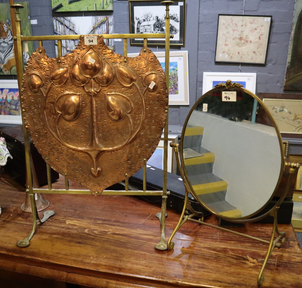 Art Deco design repousse brass fire screen with foliate decoration,