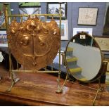 Art Deco design repousse brass fire screen with foliate decoration,