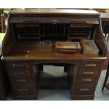 Early 20th Century oak 'S' roll tambour front twin pedestal desk. (B.P. 24% incl.