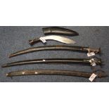 Two Indian ceremonial Tulwar swords with leather scabbards,