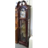 Modern Howard Miller three train longcase clock with brass face,
