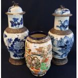 Two similar 19th Century Chinese stoneware crackle glazed baluster vases with covers,