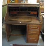 Early 20th Century oak 'S' roll tambour front single pedestal desk, with key. (B.P. 24% incl.