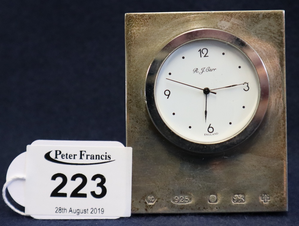 Silver faced travelling clock with white Arabic face. (B.P. 24% incl.