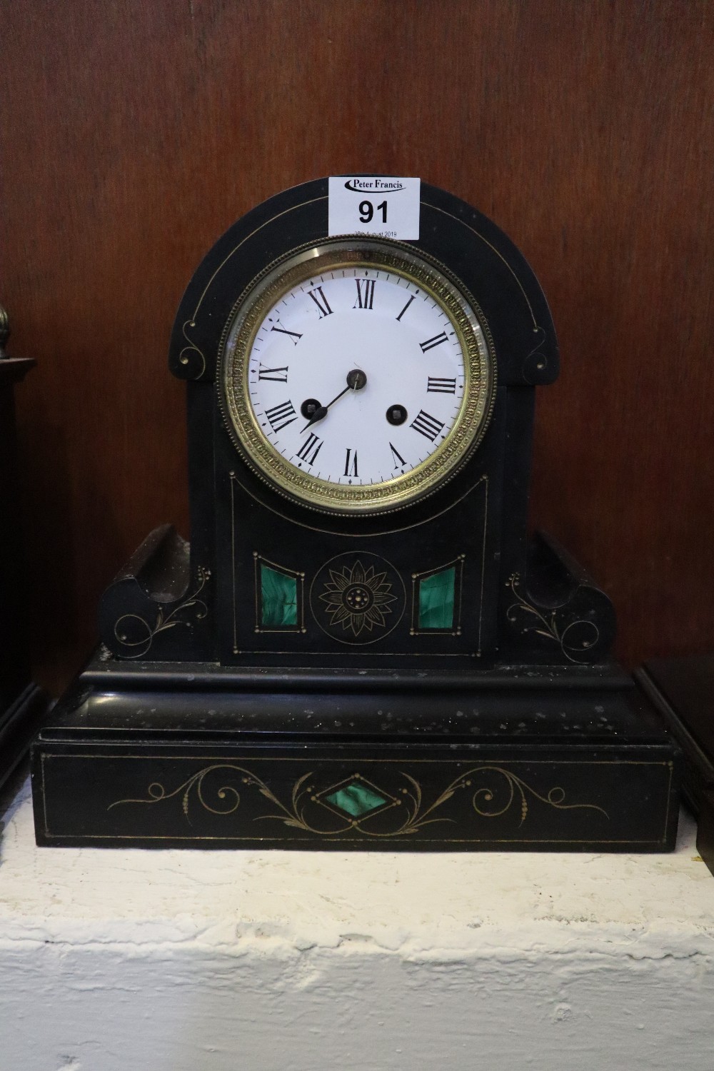 Late 19th Century black slate and marble two train mantel clock with Roman enamel face and French
