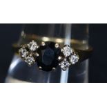 An 18ct gold sapphire and diamond cluster ring, 3g approx. (B.P. 24% incl.