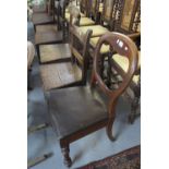 A collection of 19th Century oak bar back and stick back farmhouse kitchen chairs,