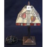 Modern Tiffany style table lamp with leaded glass shade and oxidised metal base. (B.P. 24% incl.