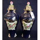 Pair of Royal Worcester porcelain baluster shaped vases and covers in 18th Century style with