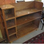 Early 20th Century oak bookcase on wheels with square glazed panels. (B.P. 24% incl.