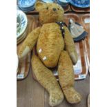 20th Century teddy bear with stitched nose, glass eyes and moveable limbs,
