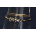 An 18ct gold diamond three stone ring. 1.1g approx. (B.P. 24% incl.