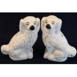 Pair of late 19th Century Staffordshire pottery white over gilded seated spaniels with painted