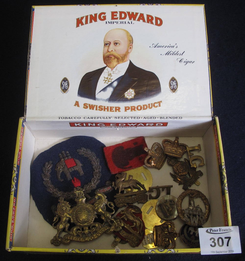 Cigar box of assorted military cap badges and insignia including; Royal Berkshire blazer badge etc.