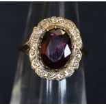 A silver gilt garnet set ring. (B.P. 24% incl.