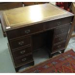 Reproduction mahogany knee hole desk of small proportion with leather inset top. (B.P. 24% incl.
