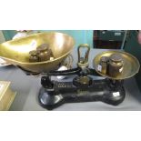Set of cast metal kitchen scales with copper pans and a graduated set of brass weights. (B.P.