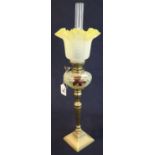 Small brass oil lamp with painted glass reservoir on brass vase shaped pedestal with square base,