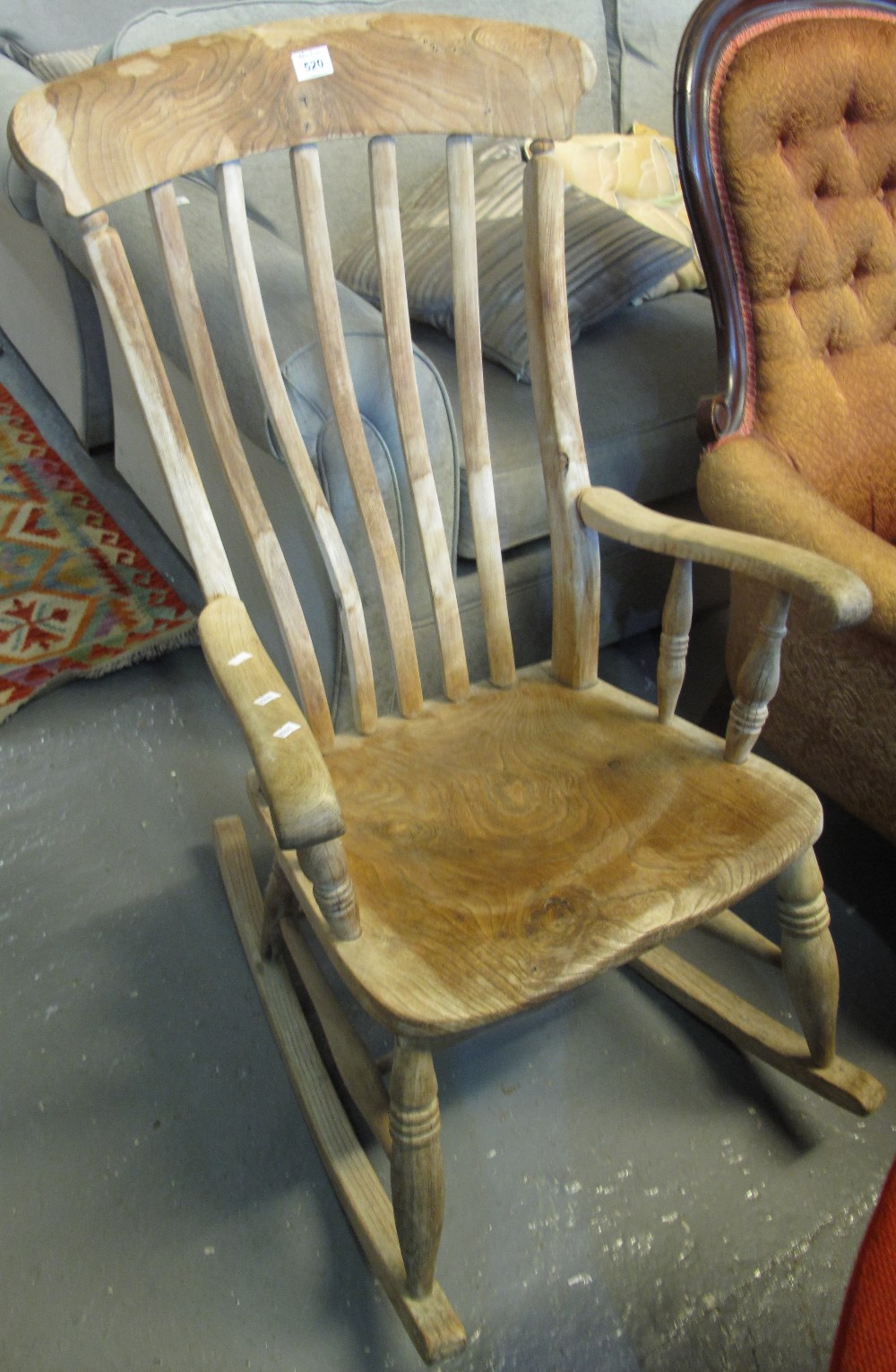 19th Century elm slat backed kitchen rocking armchair. (B.P. 24% incl.