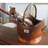 Copper beaten helmet shaped coal scuttle, together with a copper ewer jug and companion set items.