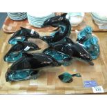 Tray of Poole pottery dolphins and pair of seals. (B.P. 24% incl.