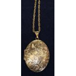 An oval engraved 9ct gold locket on 9ct gold chain. 18g in total approx. (B.P. 24% incl.