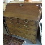 George III mahogany fall front bureau with fitted interior over two short and three long graduated