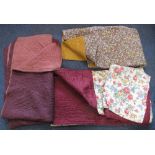 Box containing three vintage quilts to include; a paisley design with orange to the reverse,