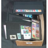 Box of all world stamps on black cards. 100's of stamps, mostly u/m mint plus a few used. (B.P.