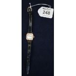 9ct gold ladies mechanical wristwatch on leather strap with engraved presentation text verso. (B.P.