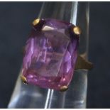 A 9ct and amethyst dress ring with large rectangular stone. 4.6g approx. (B.P. 24% incl.