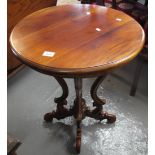 Modern hardwood circular occasional table on unusual carved supports. (B.P. 24% incl.