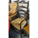 Early 20th Century Lancashire style bar back open arm chair on rush seat. (B.P. 24% incl.