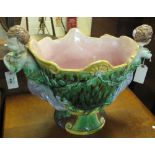 Victorian majolica oval jardiniere on pedestal base with cherub mounts (AF). (B.P. 24% incl.