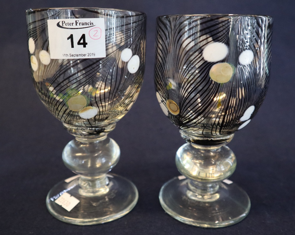 Pair of George Elliott (1933-1998) art glass goblets with enamelled swirled decoration on baluster