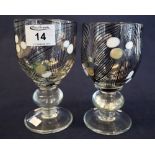 Pair of George Elliott (1933-1998) art glass goblets with enamelled swirled decoration on baluster