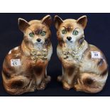 Pair of early 20th Century Staffordshire pottery seated brown and white cats with over gilded and