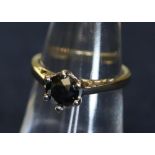 A yellow metal and black diamond ring. Metal tests as 9ct. 2.6g approx. (B.P. 24% incl.