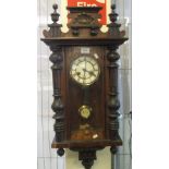 Early 20th Century walnut two train Vienna type wall clock with pendulum and weights of small