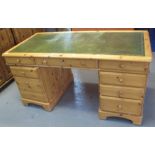 Modern pine twin pedestal knee hole desk having leather inset top. (B.P. 24% incl.