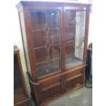 Reproduction oak display cabinet with two blind cupboards below two glazed doors. (B.P. 24% incl.