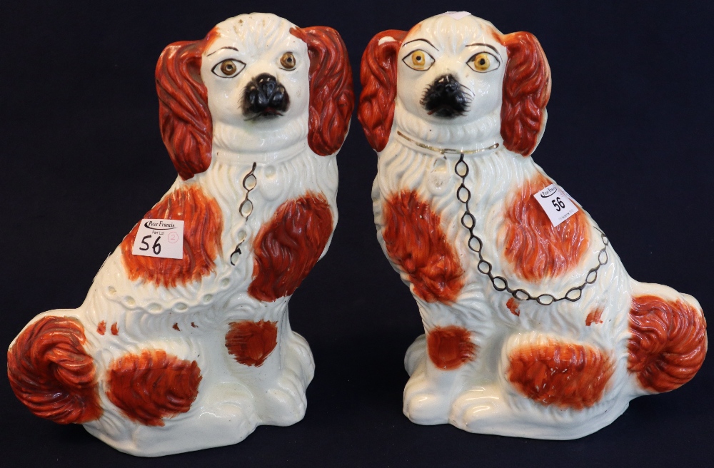 Pair of late 19th Century Staffordshire pottery red and white seated spaniels with painted features.