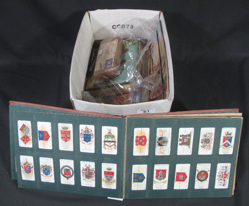 Box with various stamps in junior albums, a few presentation packs, tin of stamps,