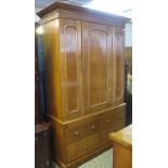 Late Victorian oak wardrobe having an arrangement of three drawers on a platform base. (B.P.