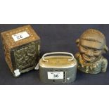 Three money boxes to include; cast iron young black boy money box,