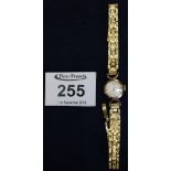 Longines small head 9ct gold ladies wristwatch with gold plated bracelet strap in Longines box. (B.