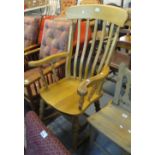 Modern beech slat backed rocking armchair. (B.P. 24% incl.