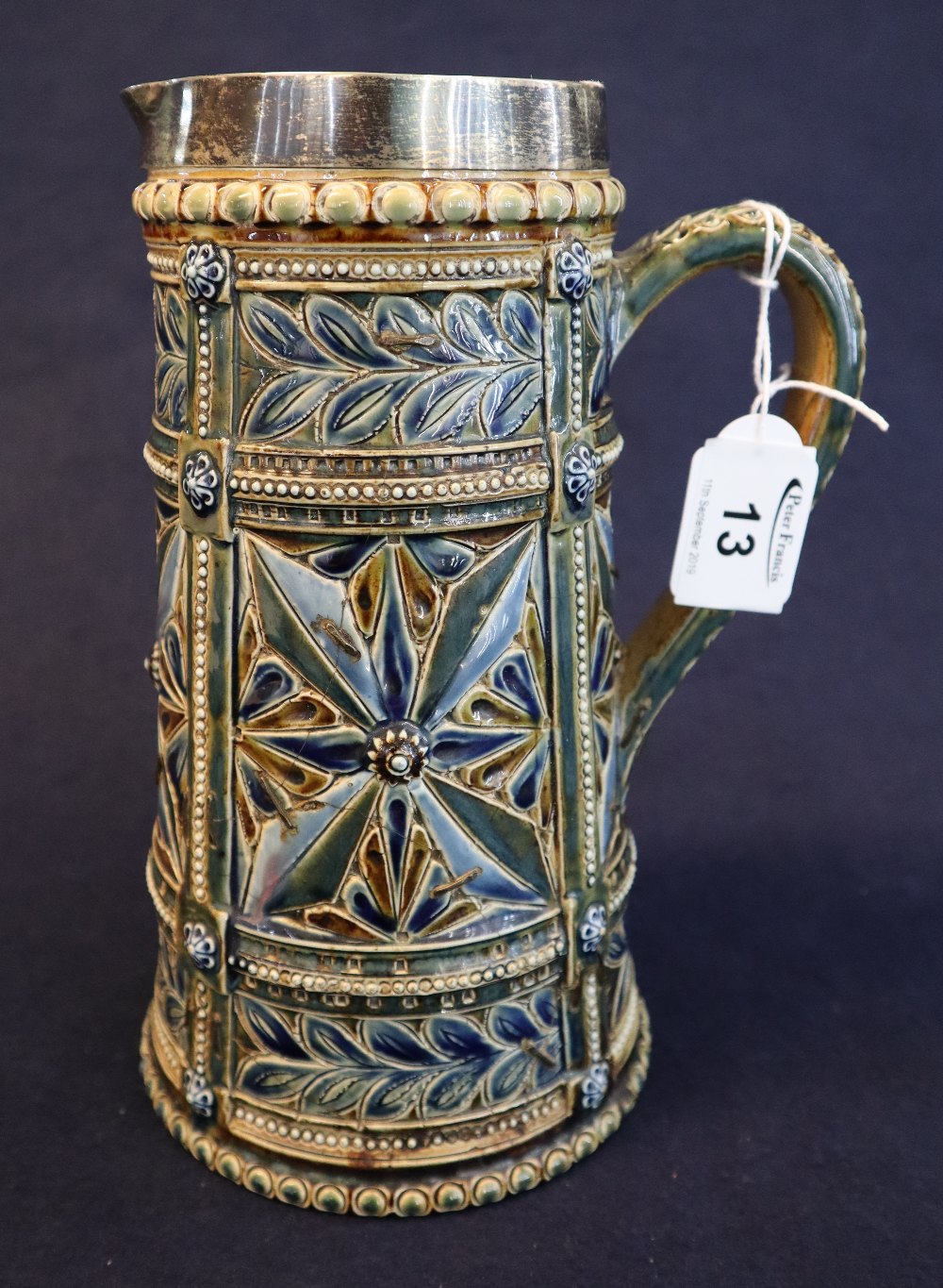 Doulton Lambeth pottery straight sided jug with sgraffito incised foliate and jeweled panels,