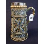 Doulton Lambeth pottery straight sided jug with sgraffito incised foliate and jeweled panels,