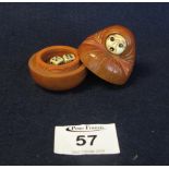 Japanese carved probably boxwood dice holder modelled as a seated figure with protruding eyes and